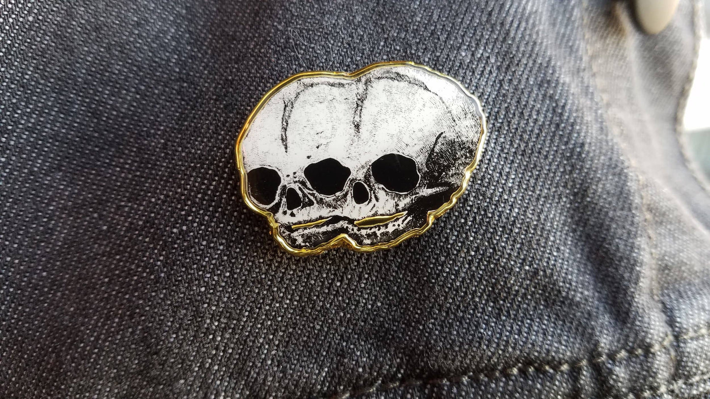 Golden Conjoined Skull Pin