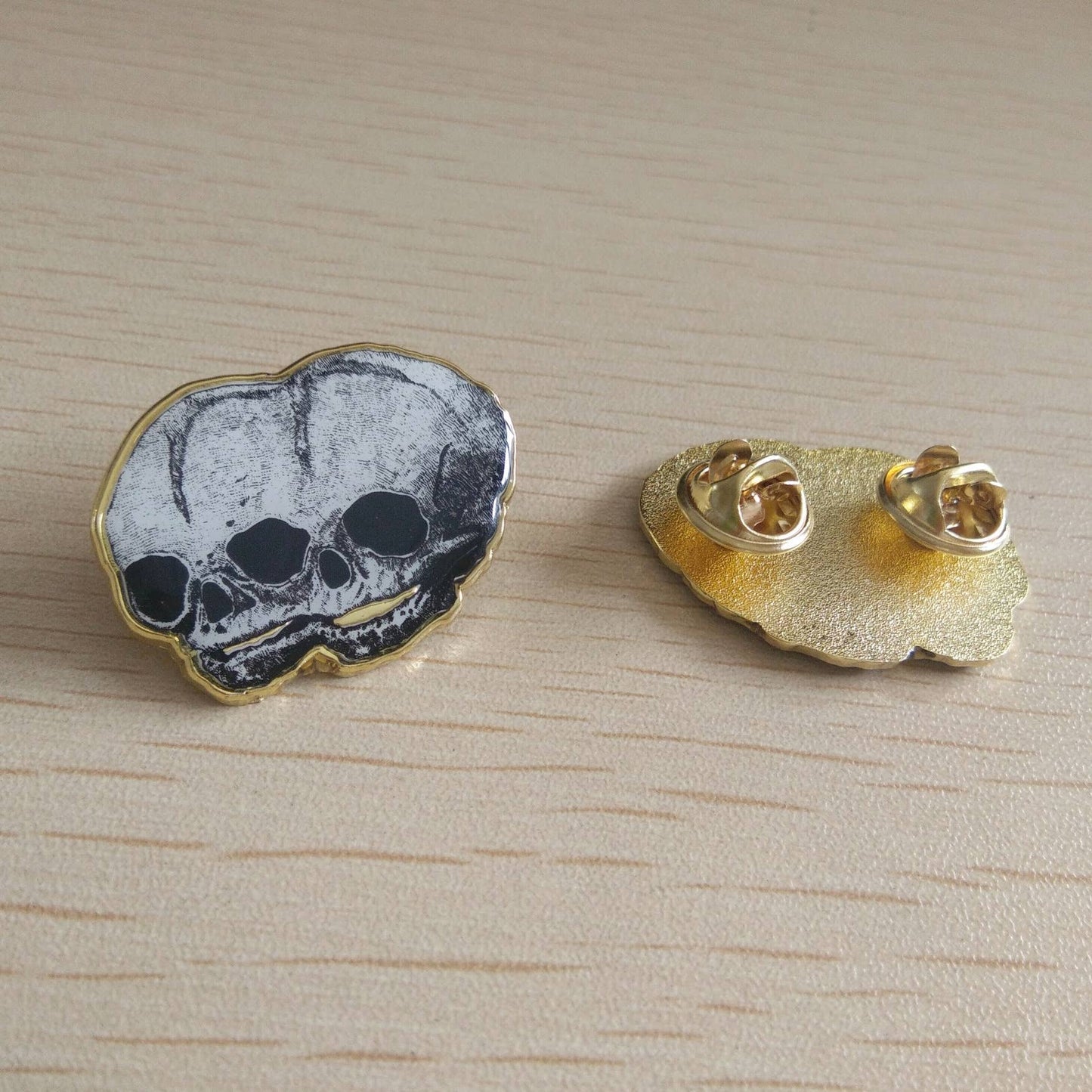 Golden Conjoined Skull Pin