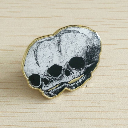 Golden Conjoined Skull Pin
